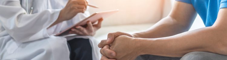 Men's health exam with doctor or psychiatrist working with patient having consultation on diagnostic examination on male disease or mental illness in medical clinic or hospital mental health service